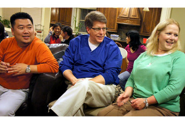 Viewpoint: They called me pastor Jim Burton, center, and his wife, Kim, visit with Vince Cho, left, and others at a Sugarloaf International Fellowship (SIF) Christmas party in 2011. Thirteen months later, doctors diagnosed Burton with ALS. He served SIF through November 2013.