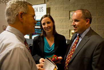 New IMB missionaries Mike and Tisha Jones (right and middle), seen visiting with a friend after their appointment May 14, both sensed God's call to missions while on a mountaintop. "I was in tears as I was leaving a city high in the Andes Mountains [during her first overseas mission trip]," Tisha said. "God whispered, 'It's OK. You'll be back.'"  IMB Photo by Thomas Graham. 