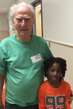 Dean Murphy Jr. picks up Brandon from his class for reading time. Brandon likes to read classic stories that Murphy enjoyed during his childhood.