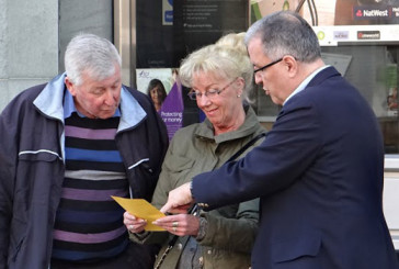 Randy Kirby, minister of music at Simpsonville First Baptist Church, has a spiritual conversation with a couple on a sidewalk in Horsham, England, in 2014.