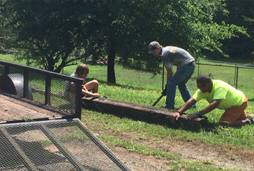 Teenage members of Powdersville First Baptist Church build a driveway at a ministry the church founded to help girls in the foster care system.