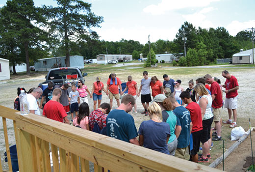 Volunteers circle for prayer following a day of ministry at Countryside mobile home park.