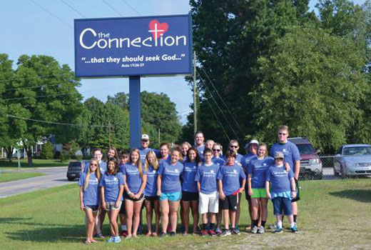 A church youth group from North Carolina helps with missions projects.