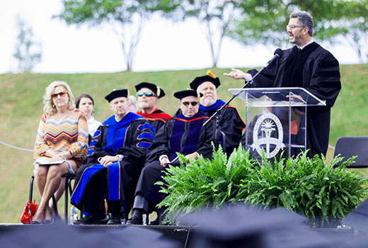 Mark Harris, executive worship pastor and artist in residence at Gateway Church in Dallas, Texas, addresses the NGU 2016 graduating class at commencement on Thursday, May 5.