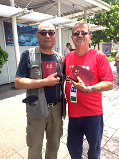 Louie Matthews, right, with Chinese man he met in a park while distributing Bibles.