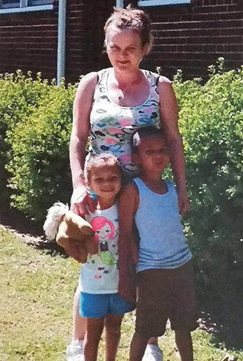 Connie Maxwell ministry director Diana Johnson keeps this photo of Heather with her children on her office wall, as a reminder of the eternal impact the program has on families.