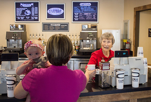 Volunteer Gayle Snowden serves customers at Ridgecrest's Clouds Coffee Shop.