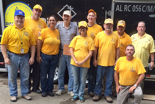 Donald Cupit (center, in white hat), a deaf homeowner and caregiver for his sister, marks the completion of mold remediation at his home in East Baton Rouge, La., by volunteers from Ridgecrest Baptist Church in Dothan, Ala. (Submitted photo)