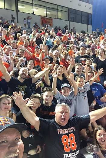 Pastor Mike Keahbone (bottom left corner) takes a selfie with members of a Putnam City High School fan club of members of Cherokee Hills Baptist Church in Oklahoma City. (Photo by Mike Keahbone)
