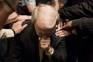 Page being prayed over